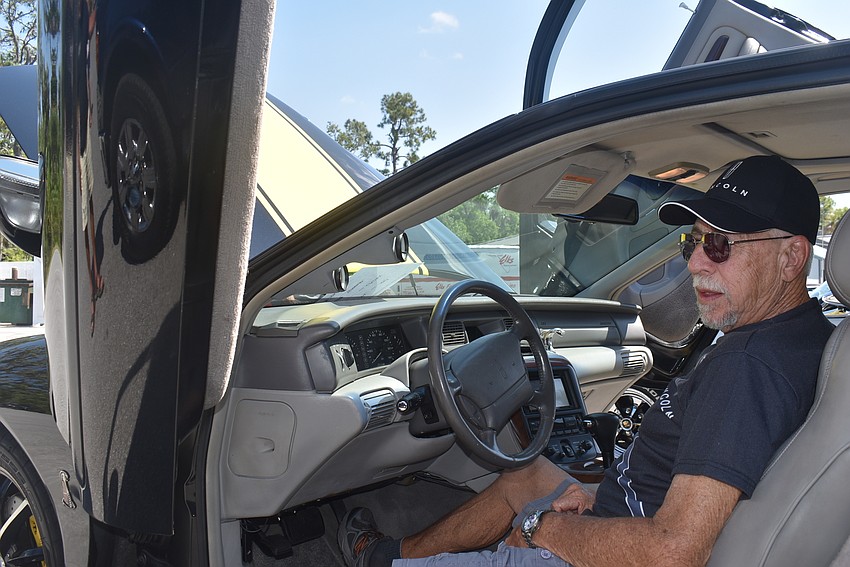 Bradenton resident Mike Sherman spent eight to nine years making modifications to this 1997 Lincoln Mark VIII, including the Lamborghini doors shown here. Other modifications included a rebuilt engine and a TV in the trunk.