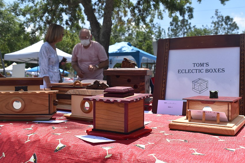 Lakewood Ranch resident Linda Fountain speaks with Larry Smith of Larry's Wood Creations, one of three woodworking businesses (including Tom's Eclectic Boxes) who showed up from Ellenton's Colony Cove woodworking club.
