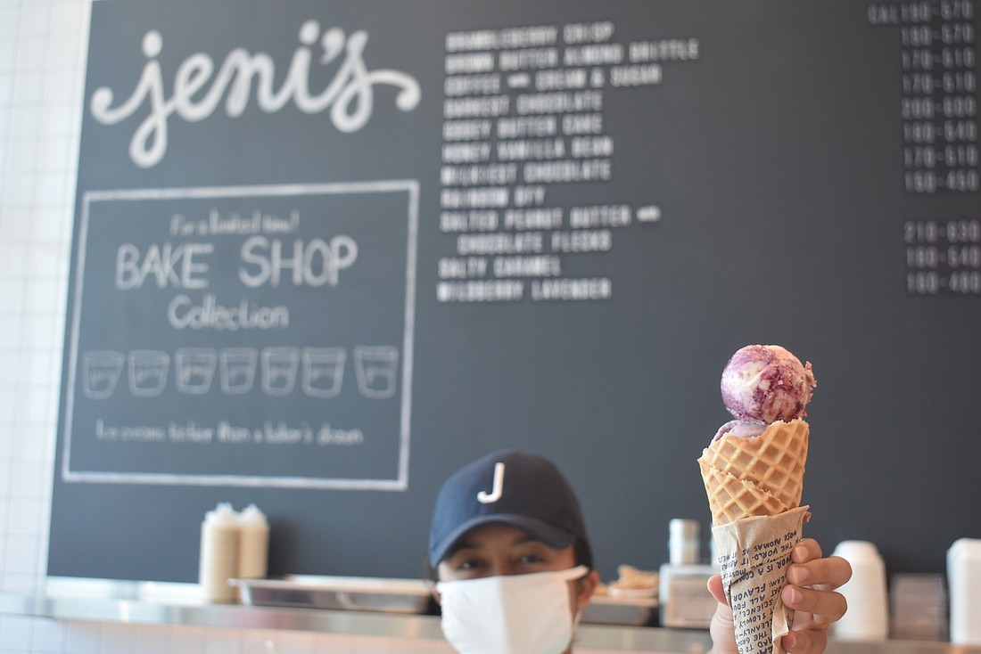 Jeni&#39;s Splendid Ice Creams Ambassador Gaby Tovar holds a waffle cone filled with brambleberry crisp ice cream, one of Jeni&#39;s signature flavors. Others include gooey butter cake and brown butter almond brittle.