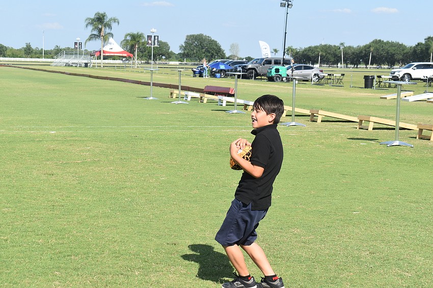 Greenbrook resident Alex Viteri, 10, looks for a receiver to throw to at Ranch Nite.