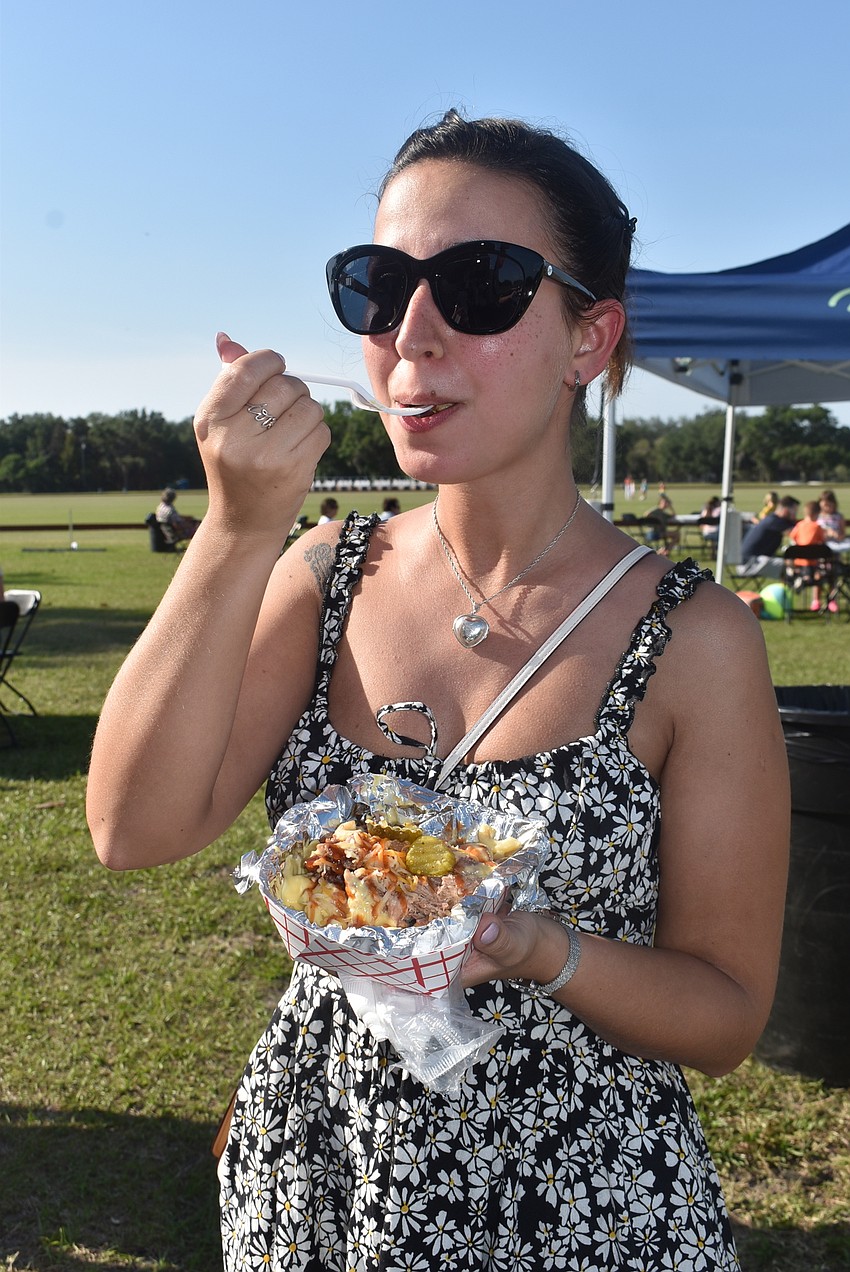 Lakewood Ranch resident Ivana Zelnick heard about Ranch Nite through Instagram and decided to come for the food trucks. She settled on loaded mac and cheese from Mouthole Barbecue.