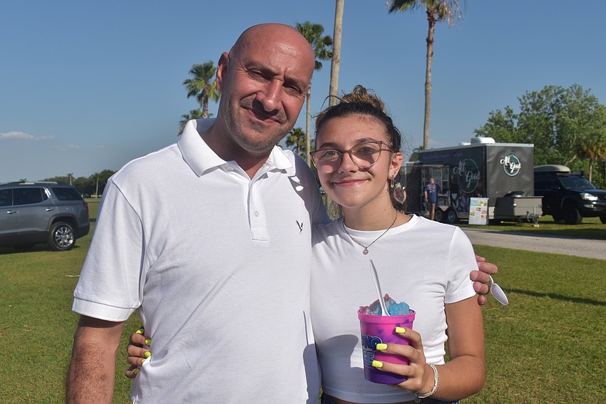 Lakewood Ranch residents Eyal and Kayla Ohana enjoyed walking around in the beautiful weather, and Kayla tried a cotton candy/blue raspberry shave ice from the Tropical Shaved Kona Ice truck.