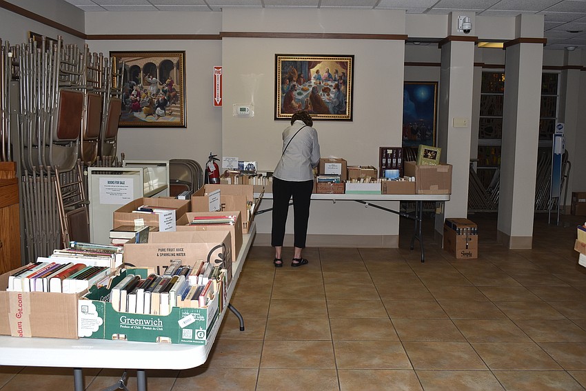 Kathy Engebretson browses books.