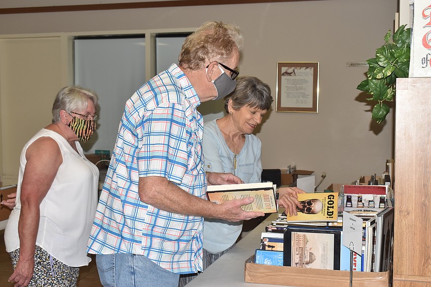 Richard Mooney flips through a history book.