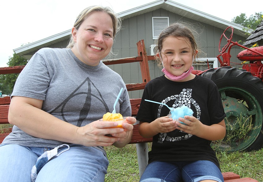 Juliette and Lily Arce sit with some treats.