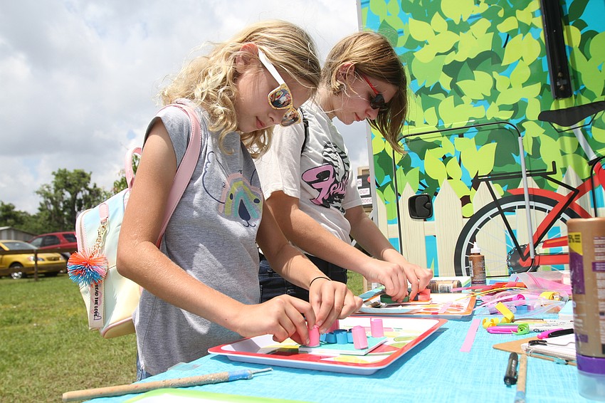 Addison and Ava Jacob paint together.