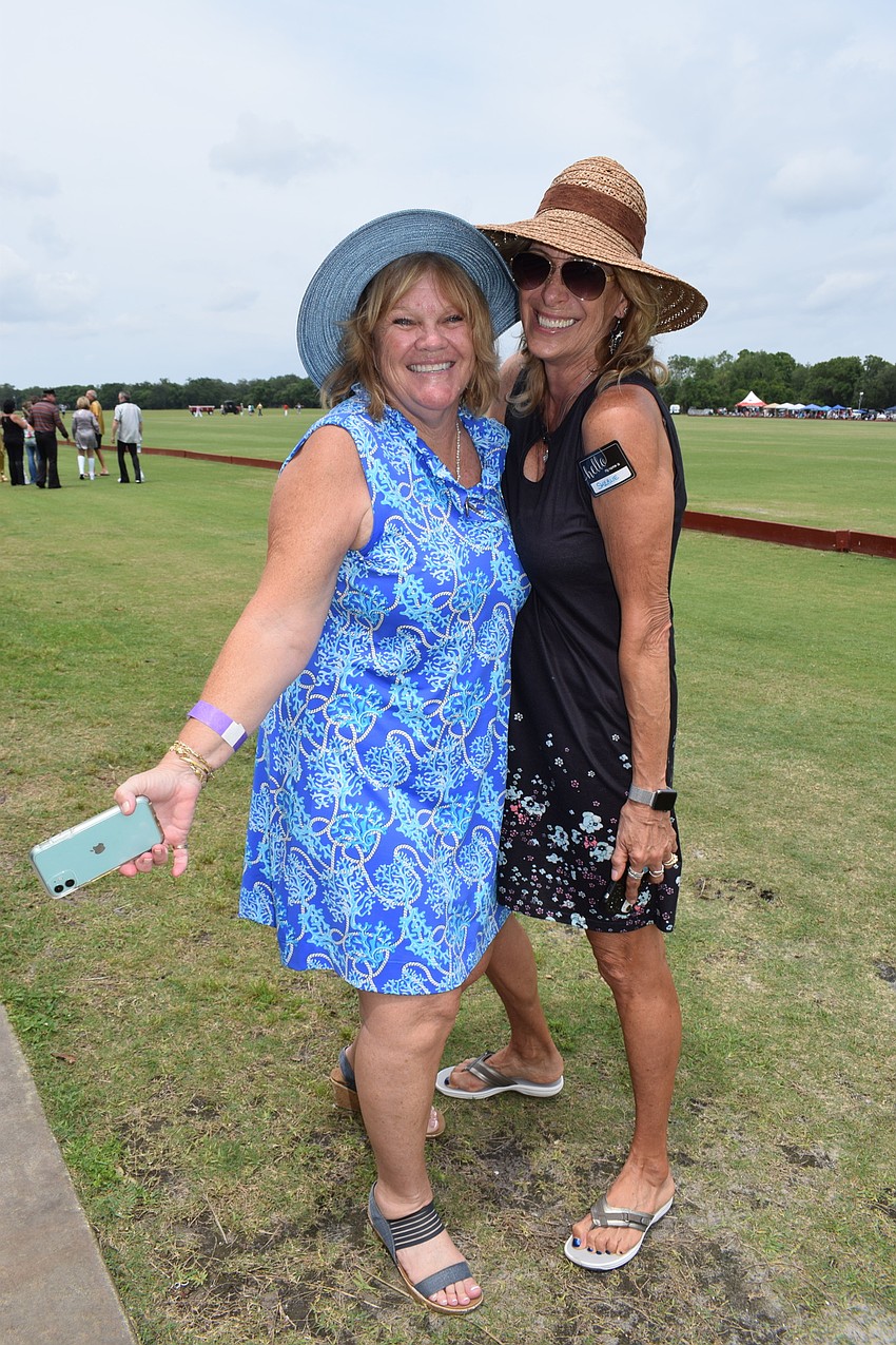 Country Club East's Pat Collins and Country Club's Sherlie Bente have fun watching polo.