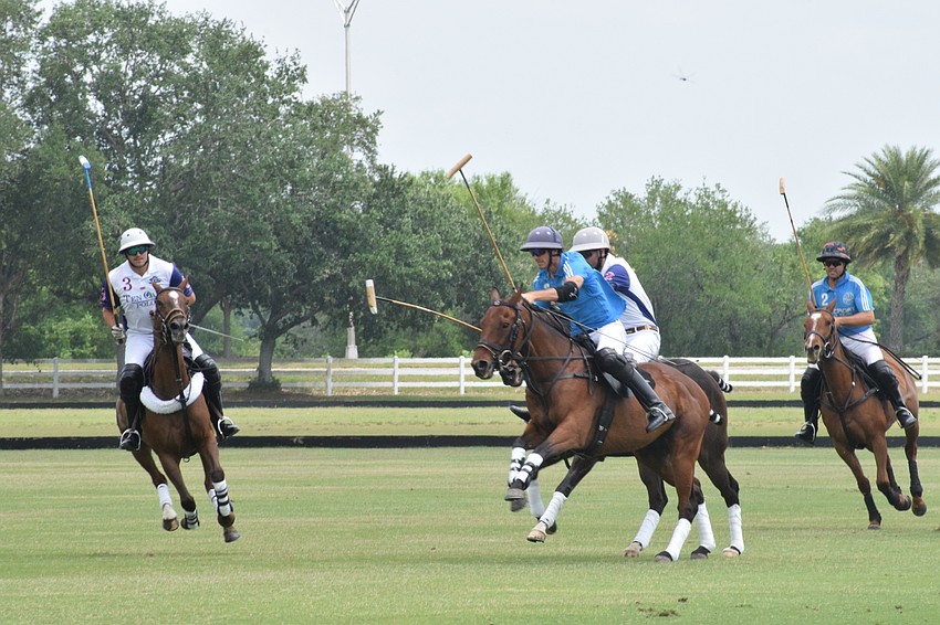 Hillcroft and Ten Oaks players sprint down the field.