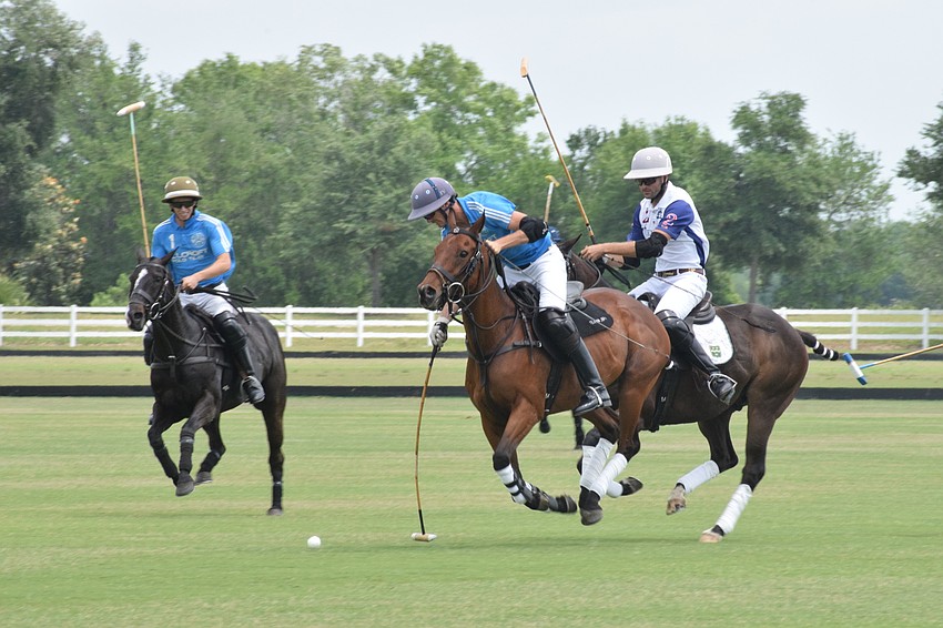 Hillcroft's Vaughn Miller Jr. makes his way down the field as Felipe Viana hits the ball ahead with Ten Oaks' Herndon Radcliff close behind.