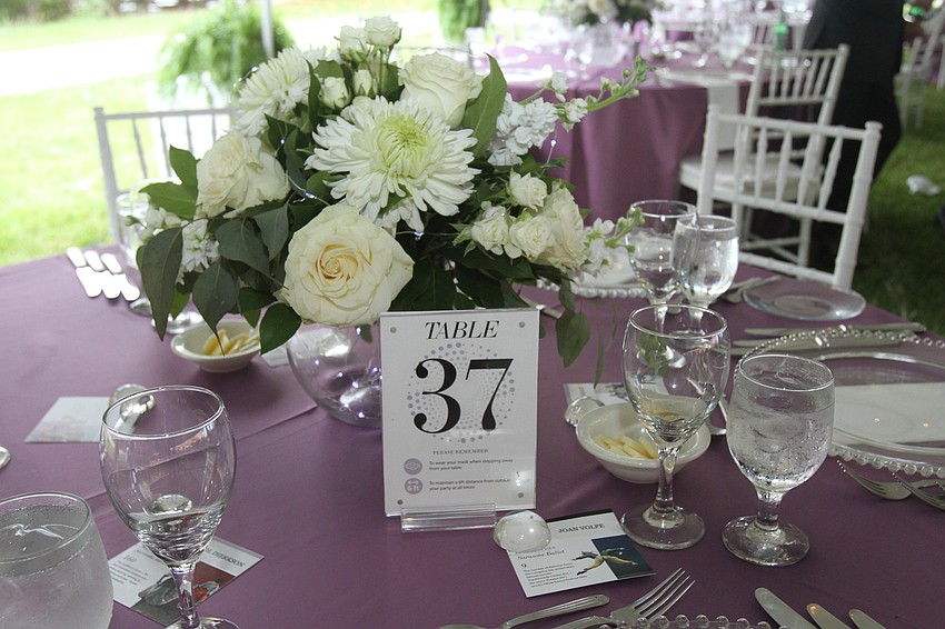The gala's dinner was held outdoors underneath a tent.