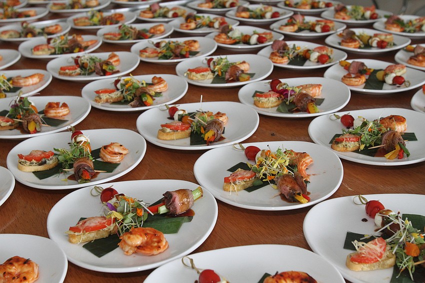 The dinner had an appetizer including artichoke puttanesca and Moroccan barbecue shrimp.