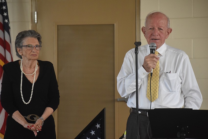 Audrey O'Leary watches as her husband, former East Manatee Fire Rescue District Commissioner Don O'Leary, speaks at the grand opening of East Manatee Station 8, which is dedicated in his honor.