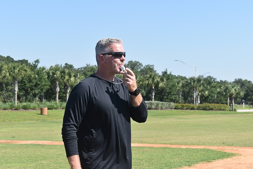 Anchor Fitness & Performance owner Graham Anderson blows his whistle to signal the start of sprints.