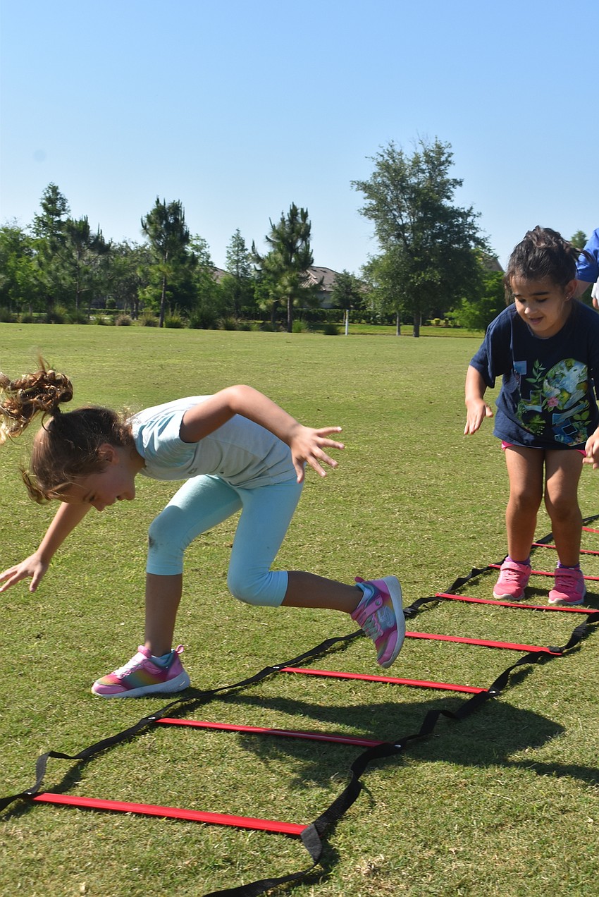 Greenbrook resident Nora Clementi stumbles her way out of the ladder as Greyhawk Landing resident Hailey Brooks follows behind her. Brooks says 