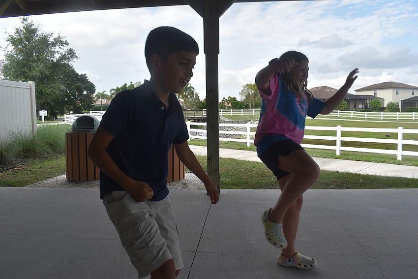 Bridgewater resident Veer Chauhan, 7, and Greenbrook resident Nahla Vlasak, 9, shake themselves out at the beginning of class. Acting coach Alyssa Goudy says it's vital to warm up before acting because of the activities involved.