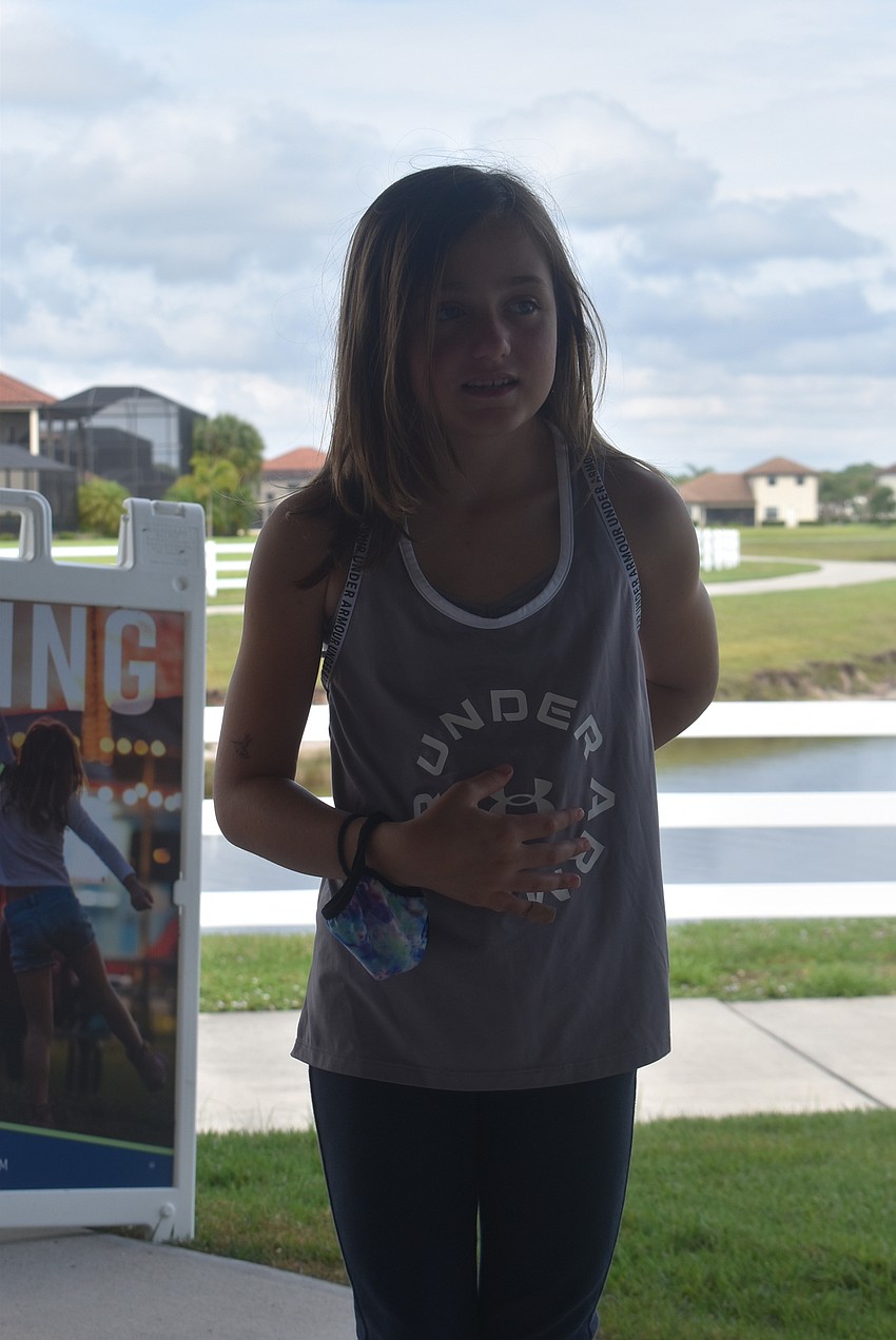 Greenbrook resident Ava Clementi, 8, learns how to find her diaphragm. Acting Coach Alyssa Goudy says the purpose of this exercise is to learn how to breathe deeply with one's stomach.