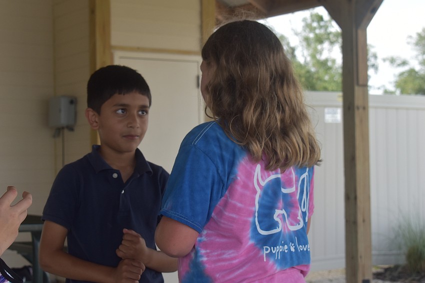 Bridgewater resident Veer Chauhan, 7, and Greenbrook resident Nahla Vlasak, 9, play a game called 