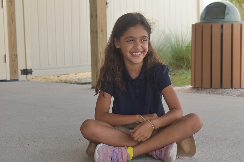 Bridgewater resident Adaa Chauhan, 9, plays a game in which one player starts a story and each player after must continue it. This story was about a lion eating a mouse and sneezing it out of his nose.