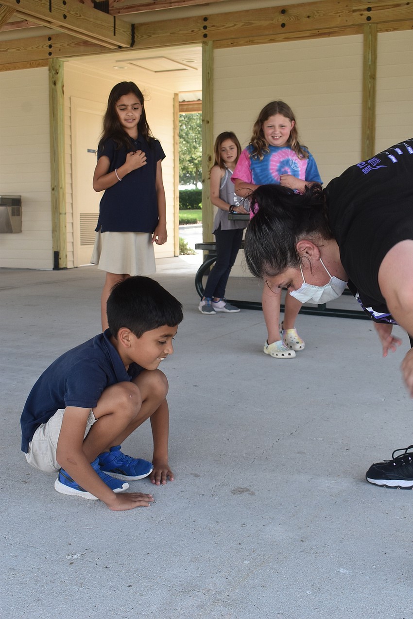 Bridgewater resident Veer Chauhan, 7, pretends to be a worm during the game 