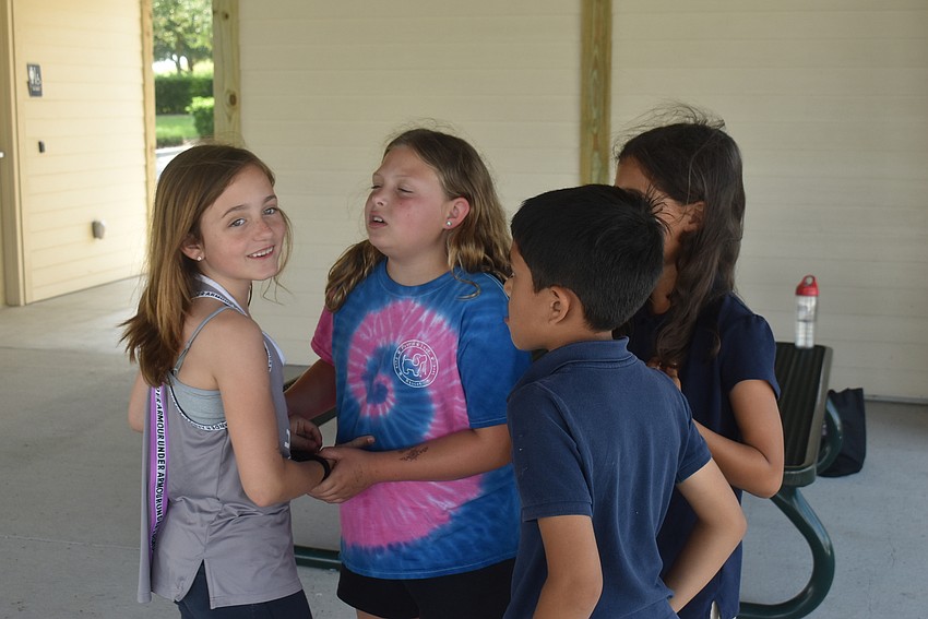 Greenbrook residents Ava Clementi, 8, and Nahla Vlasak, 9, and Bridgewater residents Veer Chauhan, 7, and Adaa Chauhan, 9, decide who Clementi should portray for the game 