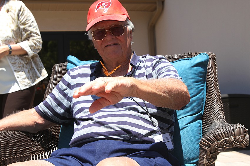 Sid Fleming observes a butterfly.