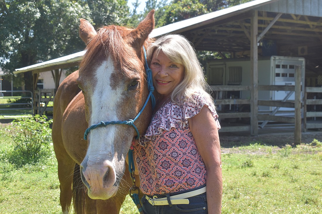 Myakka City resident Carol Felts, pictured with one of her horses, JR, hopes her campaign for Manatee County Commission will shine a spotlight on local government and teach people to be engaged citizens.