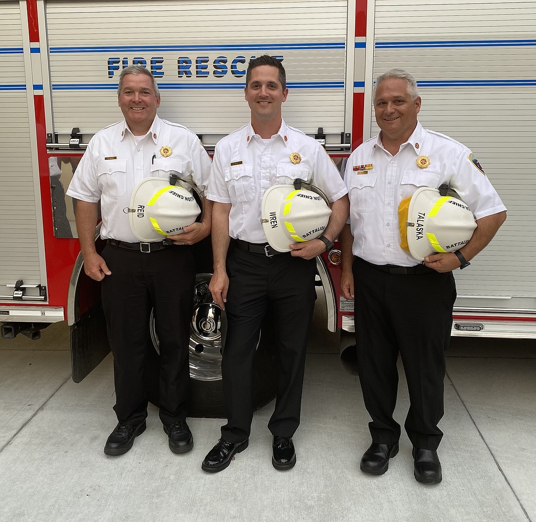 Charles Reid, Paul Wren and Matt Talaska are pictured after being recognized as newly promoted battalion chiefs at the grand opening of East Manatee Fire Rescue District&#39;s Station 8 April 19. Courtesy of East Manatee Fire Rescue.