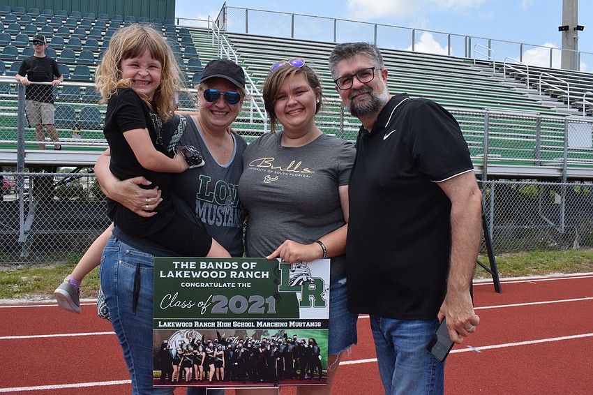 Zoey Miller, Karissa Miller, Hannah Miller and Jason Miller celebrate Hannah Miller's last year in the Marching Mustangs. Hannah Miller will be attending the University of South Florida in the fall and hopes to be in the band.