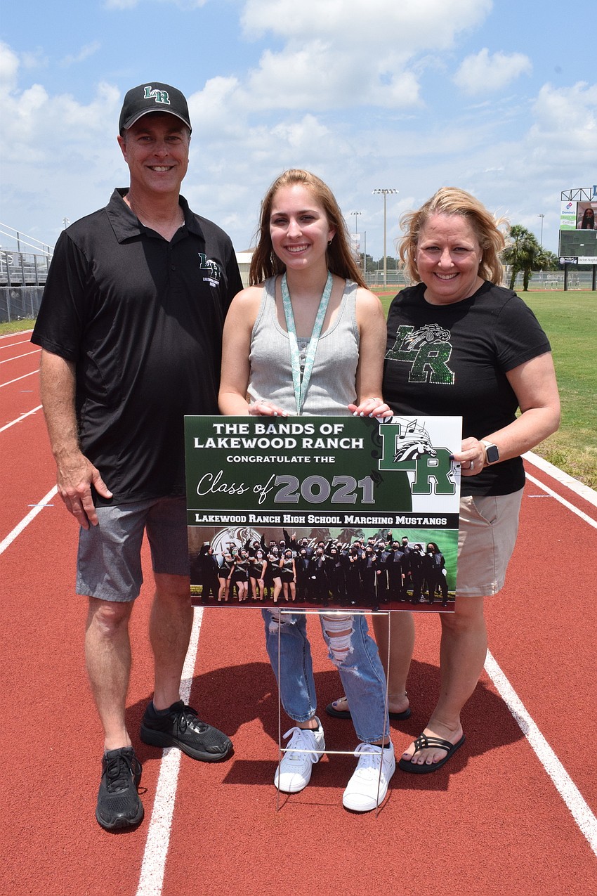 Paul Shirey honors his daughter, Mallory Shirey, who is a senior, with his wife, Gloria Shirey.