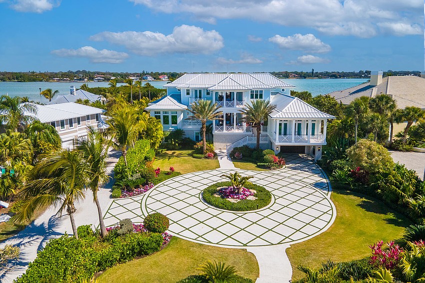 The home is situated on a section of Casey Key with views of both the Gulf of Mexico and Blackburn Bay.