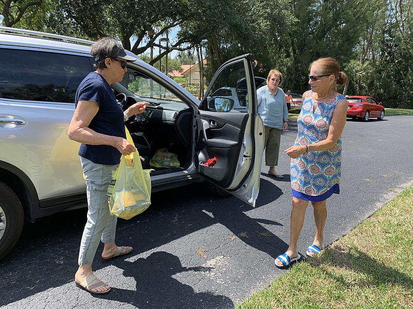 Karen Gary greets donor Ginny Lipton.