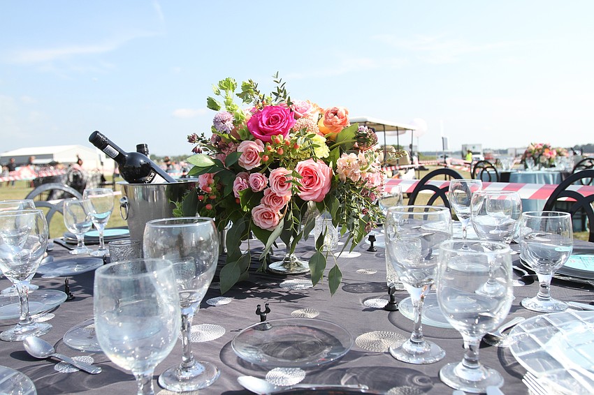 The event had a mix of 50s table decor with classic floral arrangements.