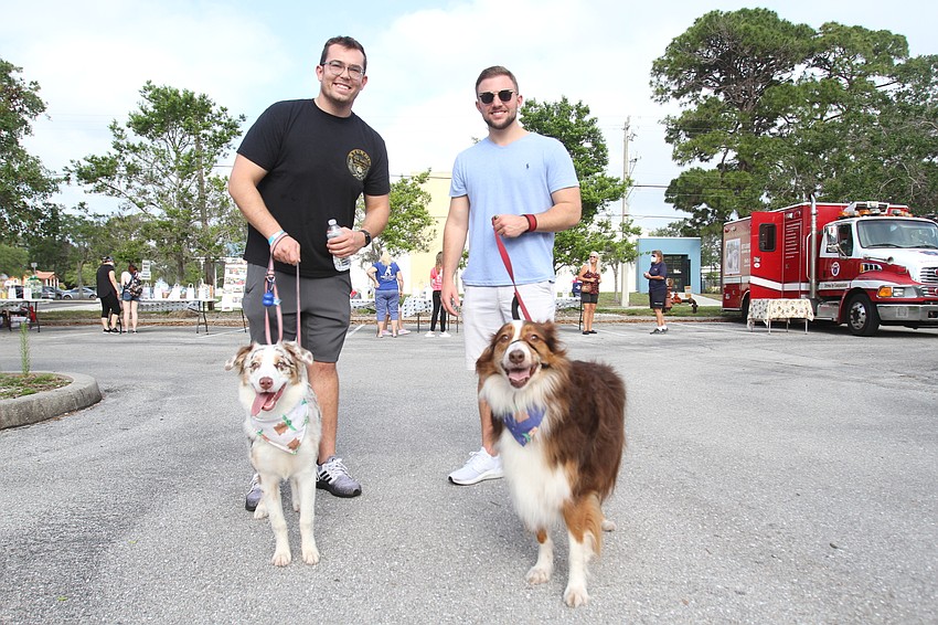 Justin Ballante and Phoebe the dog with Gary Meskil and Bruce the dog