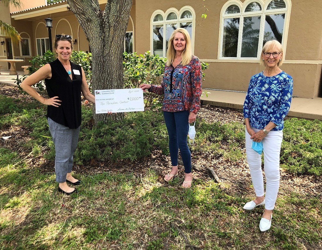 Longboat Key Garden Club President Susan Phillips, center, and LBKGC grants committee chair Linda Ulrich, right, present a check to Paradise Center executive director, Suzy Brenner, left. Courtesy photo.