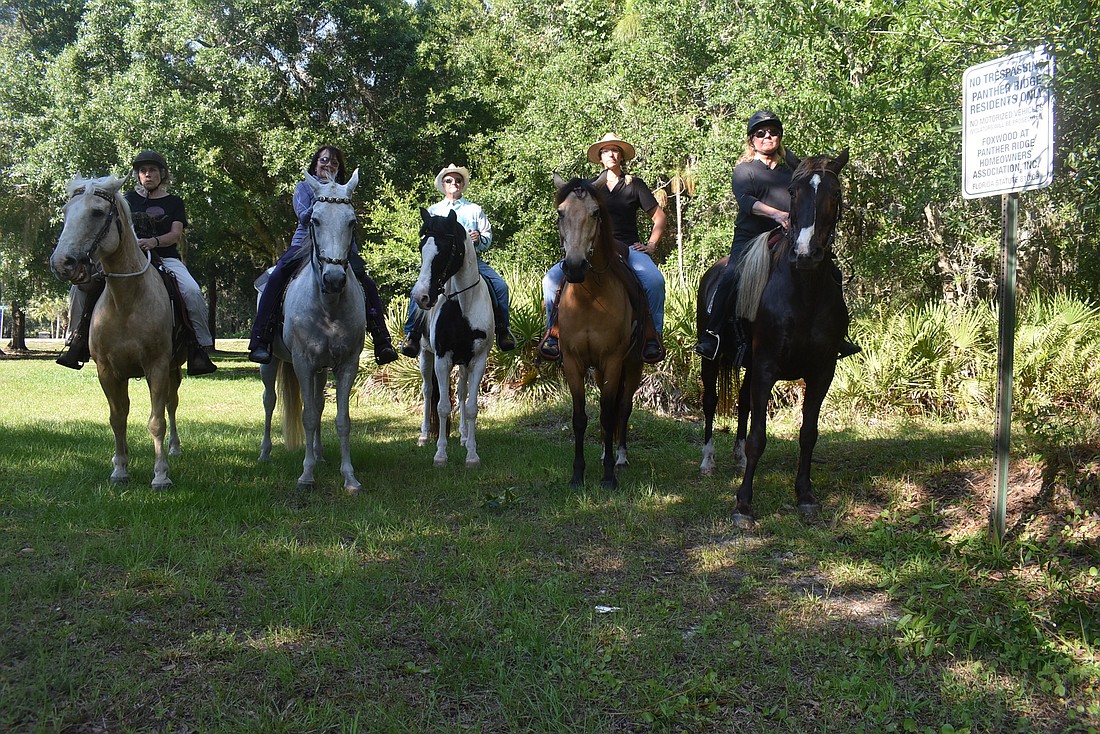 Horseback riders from Panther Ridge and the Concession show their opposition to a land use amendment that would addÂ 15 single-family homes near the entrance to the Concession.