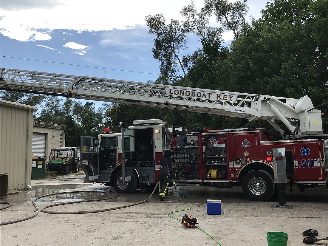 Firefighter/Paramedic Jamison Urch put out a building fire. Photo provided by the town of Longboat Key.
