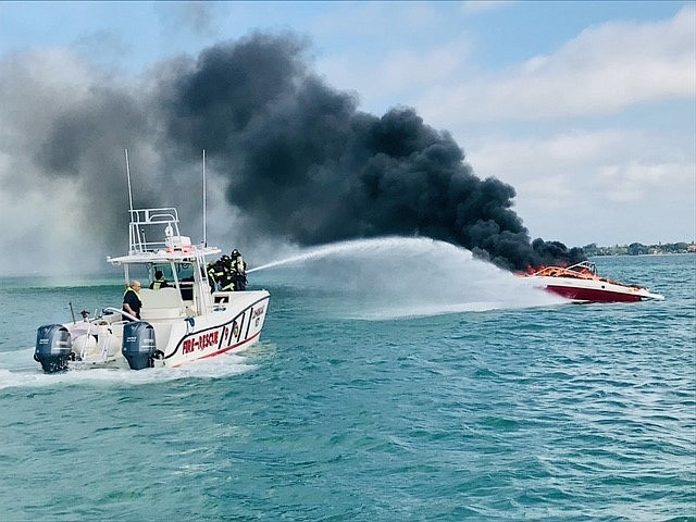 Longboat Key Fire Rescue personnel put out a boat fire in Sarasota Bay. Photo provided by the town of Longboat Key.