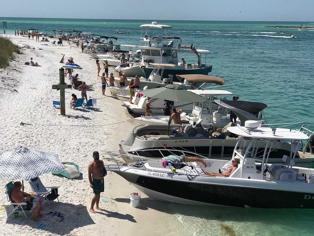 Several boaters dock on the weekends on the north end of Longboat Key. Photo courtesy of James Haft.