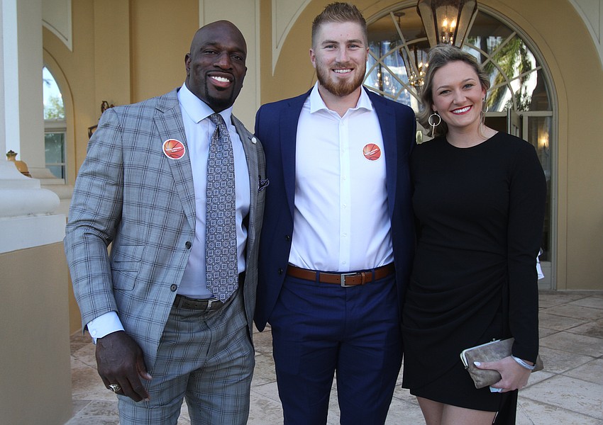 Titus O'Neil, Kyle Trask, former University of Florida quarterback and the top pick of the Tampa Bay Buccaneers, and Jude Caraway.