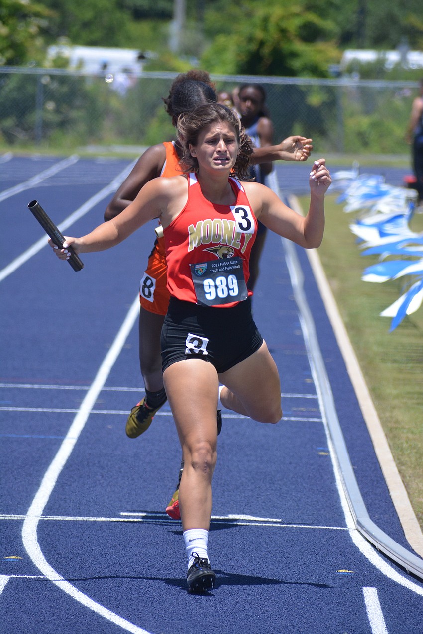 Cardinal Mooney junior Jenna Santiago crosses the finish line during the Class 2A girls 4x400 relay. The Cougars would finish 10th (4:07.64).