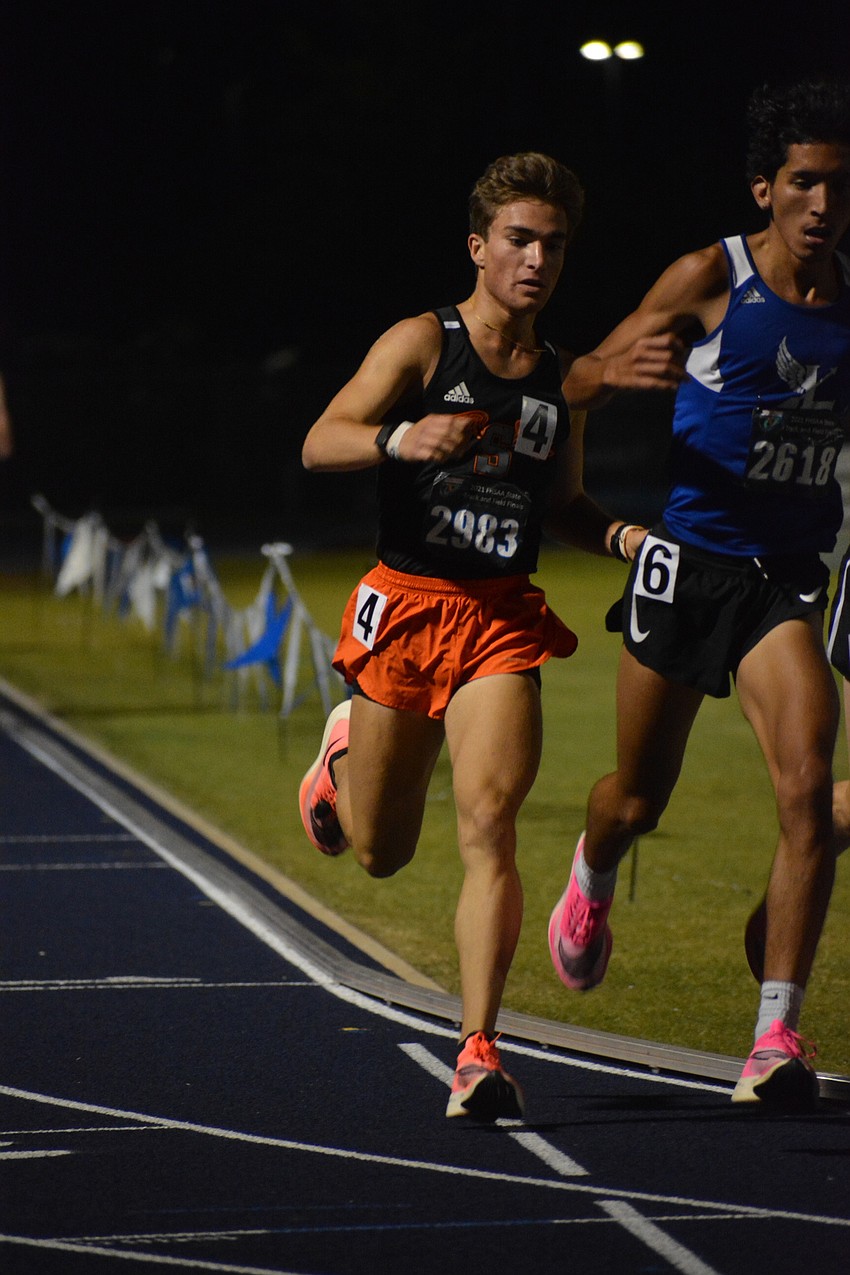 Sarasota senior Orlando Cicilioni rounds a corner during the Class 4A boys 3,200 meter run. Cicilioni would finish sixth (9:16.43).
