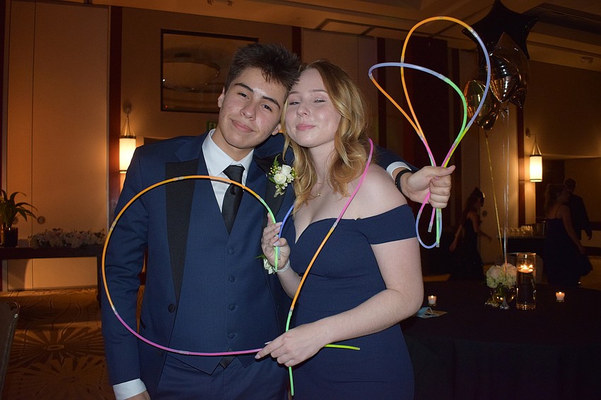Lakewood Ranch High junior Isaias Morales and senior Jordan Heffner hope to make a memory at prom using glow sticks.