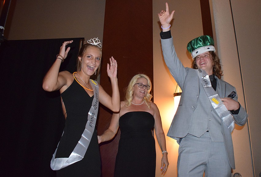 Seniors Fallon Gehrke and Evan Taylor celebrate winning prom queen and king. 
