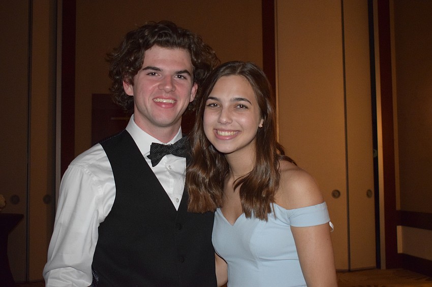 Seniors Jacob Patrick and Alise Mirikitani are glad to see friends at prom before they graduate in June.