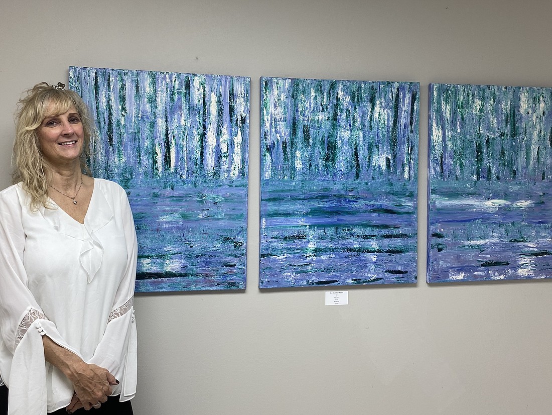 JoJo Fusco with triptych "The Blue Lagoon."