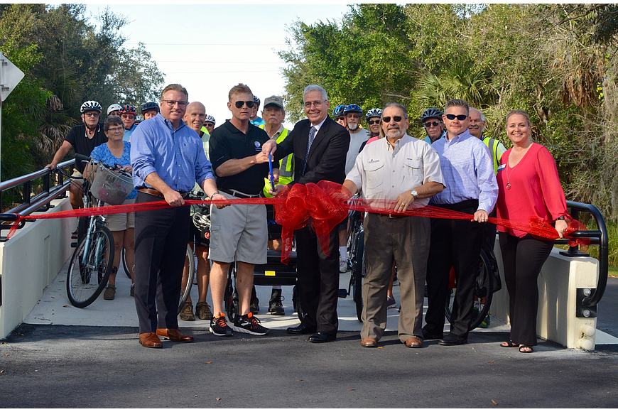 Stakeholders cut the ribbon on a Legacy Trail overpass at Laurel Road in January 2019.