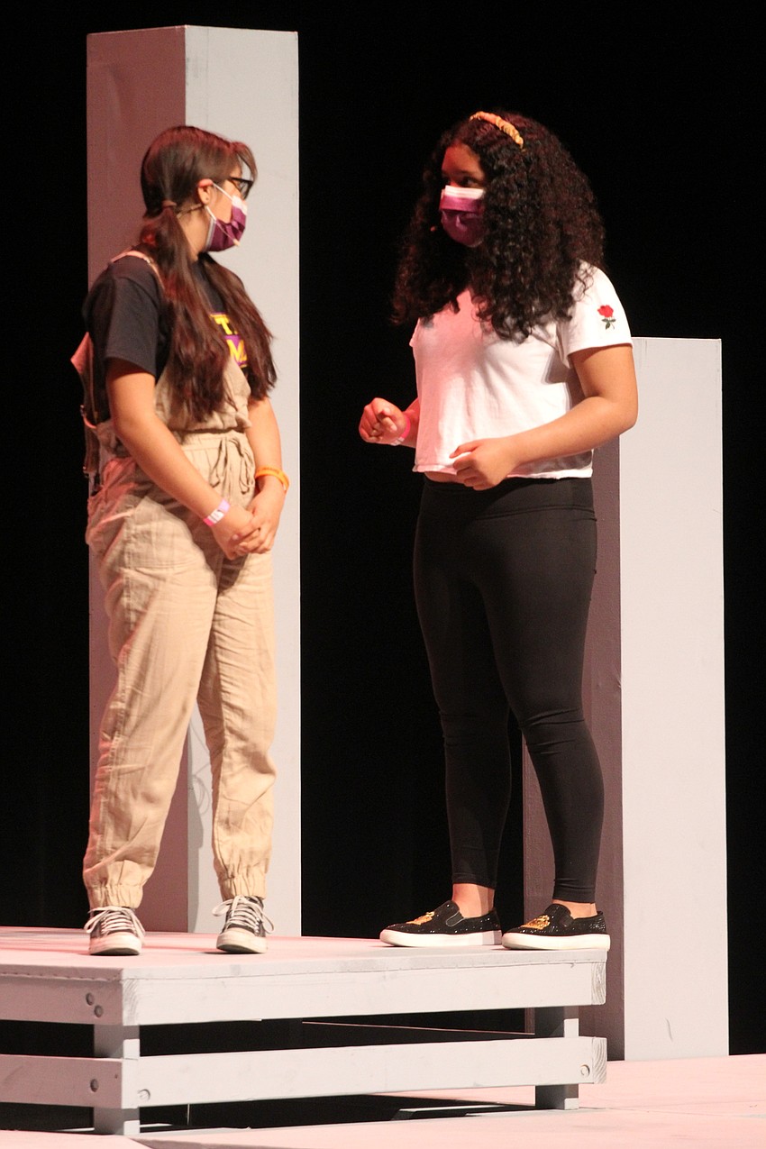 Ariyana Rivera and Sondra Jimenez act together on stage.