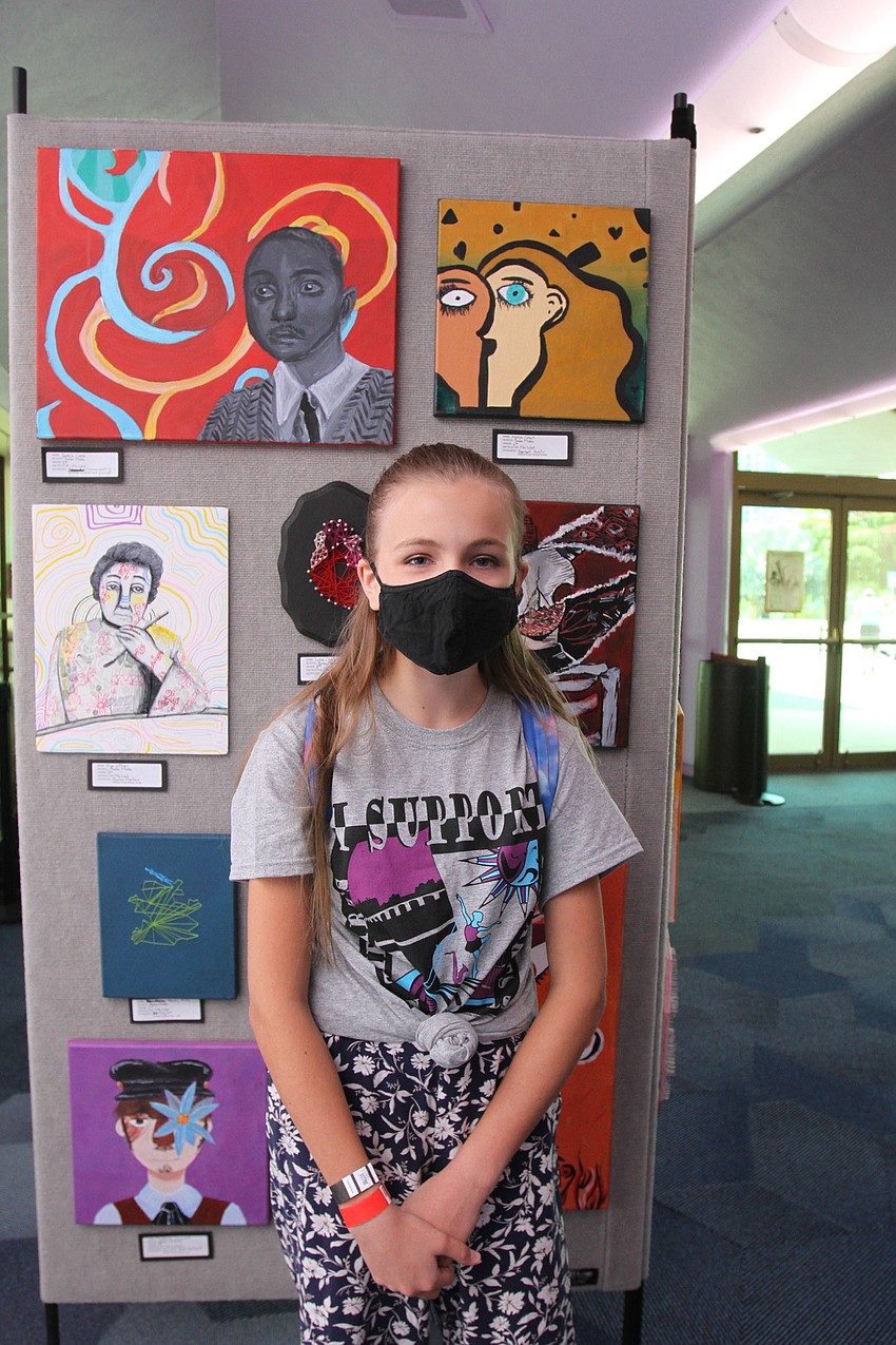 Matilda Casart checks out her art.