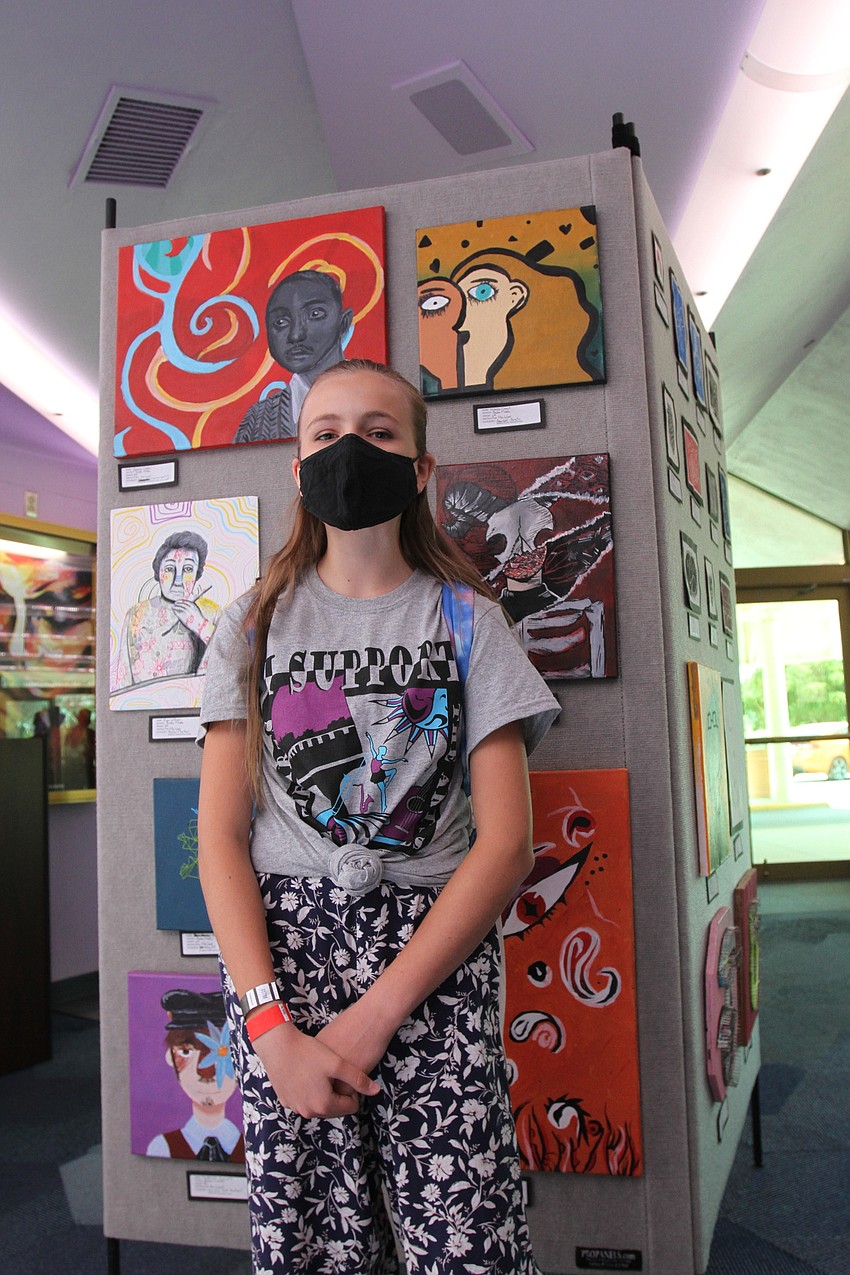 Matilda Casart checks out her art.