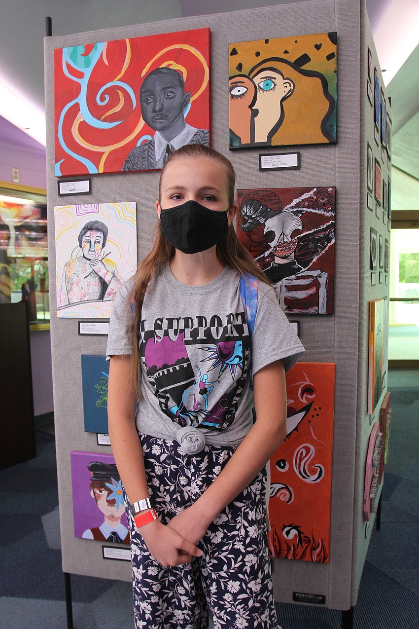 Matilda Casart checks out her art.